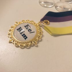 Pronouns tag he/him pride medal
